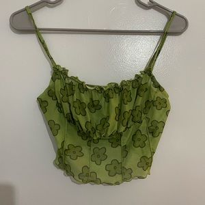See through SHEIN green flower going out top.